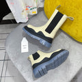BOTTEGA VENETA TIRE CHELSEA BOOT IN BLACK MIX BISQUE BEIGE CALFSKIN WITH STEEL BLUE SOLE